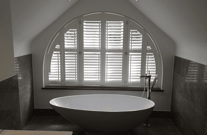 Plantation shutters for wide arch windows