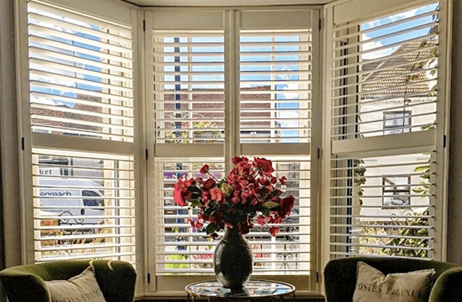 White angular bay shutters
